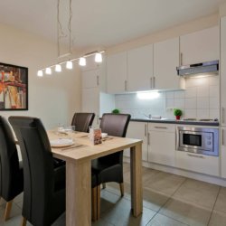 fully equipped kitchen and dining table in bbf serviced apartment madou