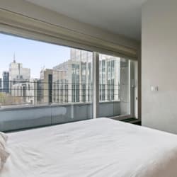 manhattan view two bedroom apartment double bed with city views