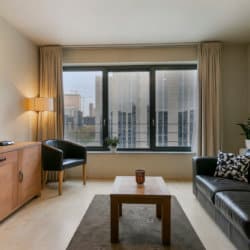 spacious living room in studio apartment near brussels world trade centre