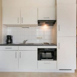 serviced apartment with fully equipped kitchen coffee machine and microwave oven