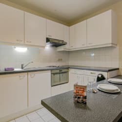 fully equipped kitchen with microwave in bbf serviced apartment woluwe