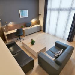 view over living room and office space in two bedroom furnished apartment near european commission