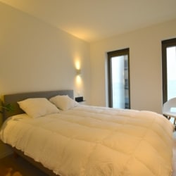 A furnished bedroom in Kaai 15 Residence in Ghent.